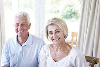 A cropped shot of a woman holding a loved one's hand in support.